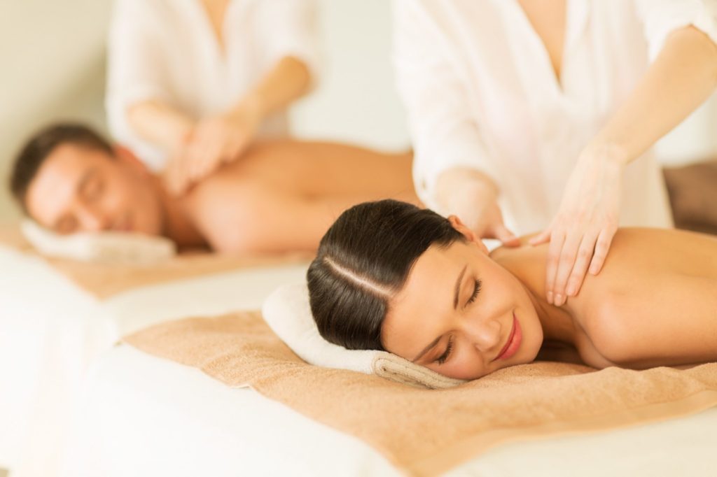 a couple enjoying oil massage